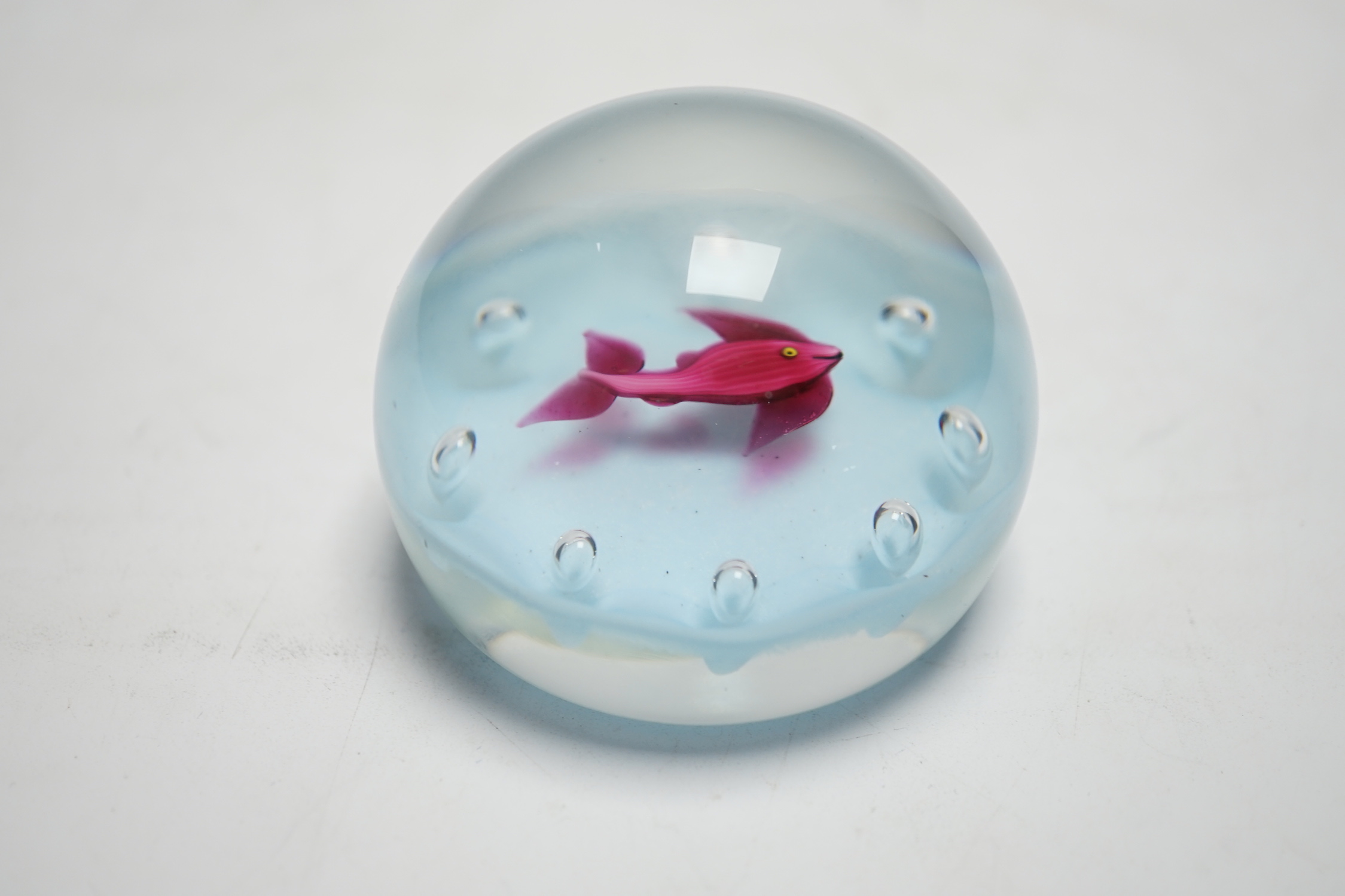 A Paul Ysart ‘fish’ glass paperweight, Harland period, opaque white ground, ‘H’ cane, paper label, 7cm